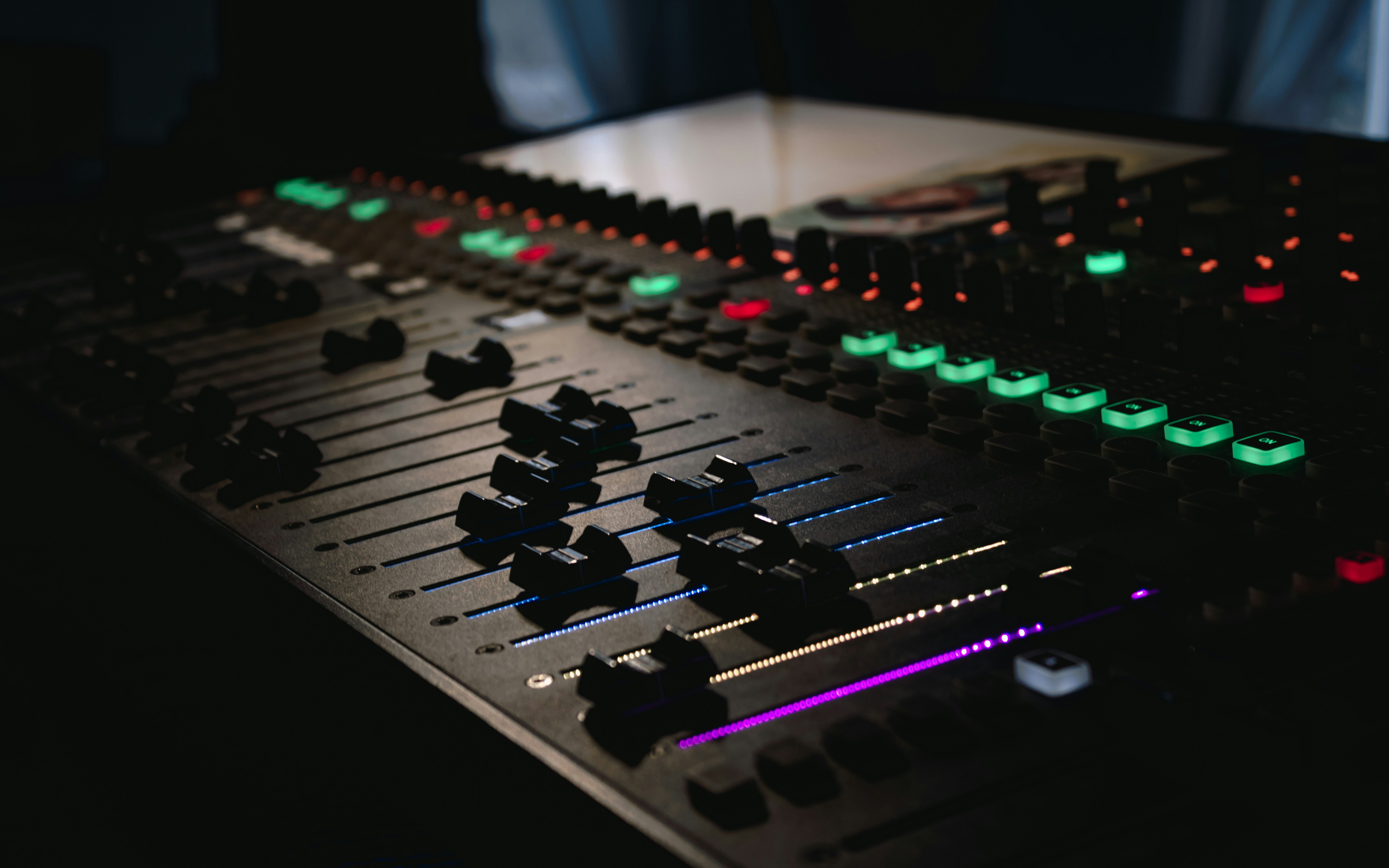 Mixing console in a professional audio workspace